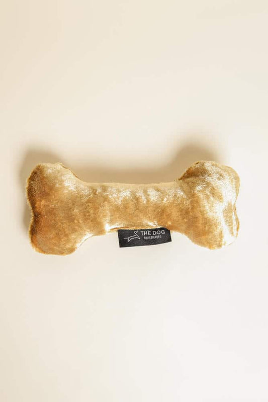 Dog cuddly toy made of gold velvet fabric